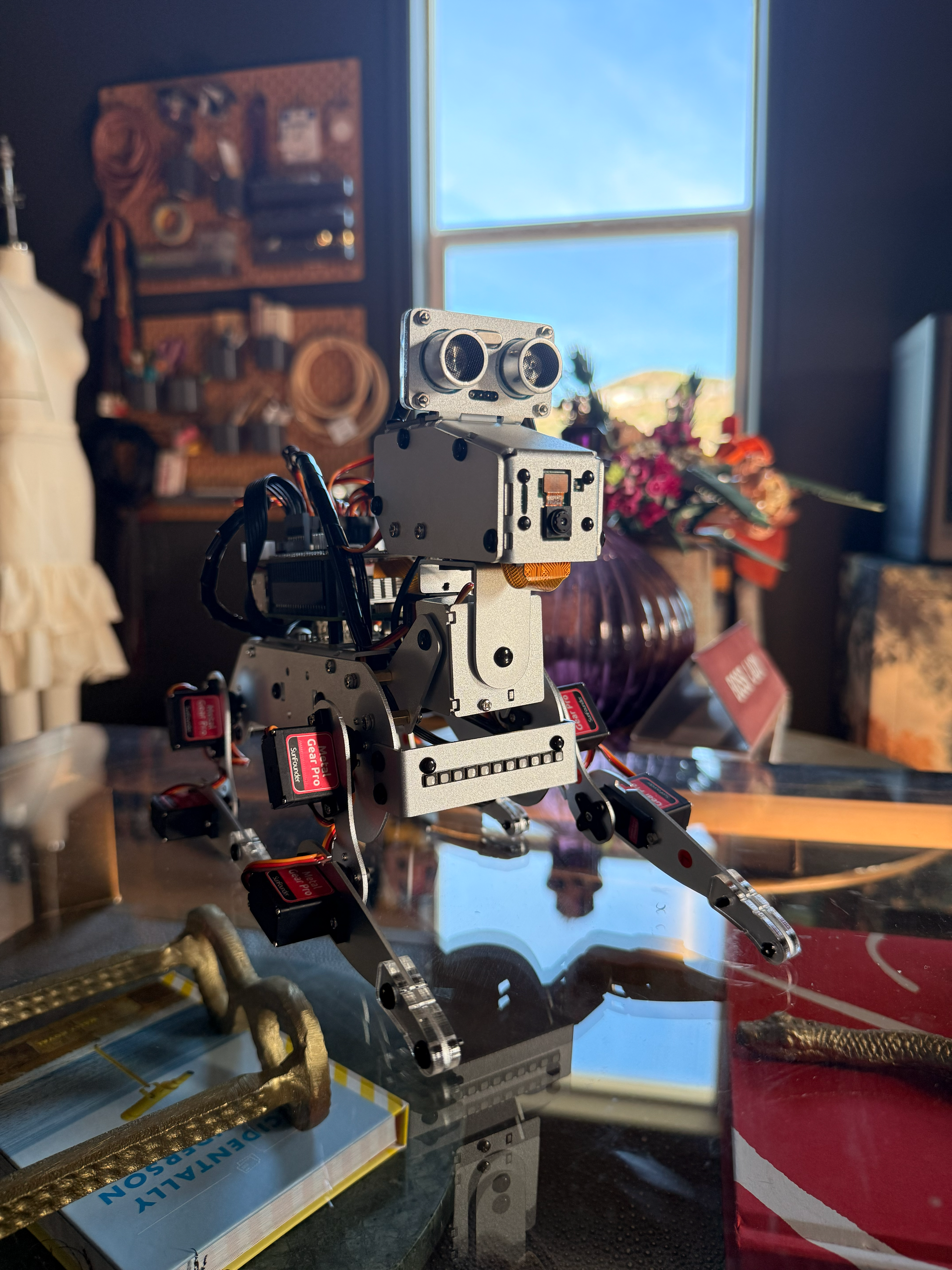 Pixel, the quadruped robot dog, standing on a desk.